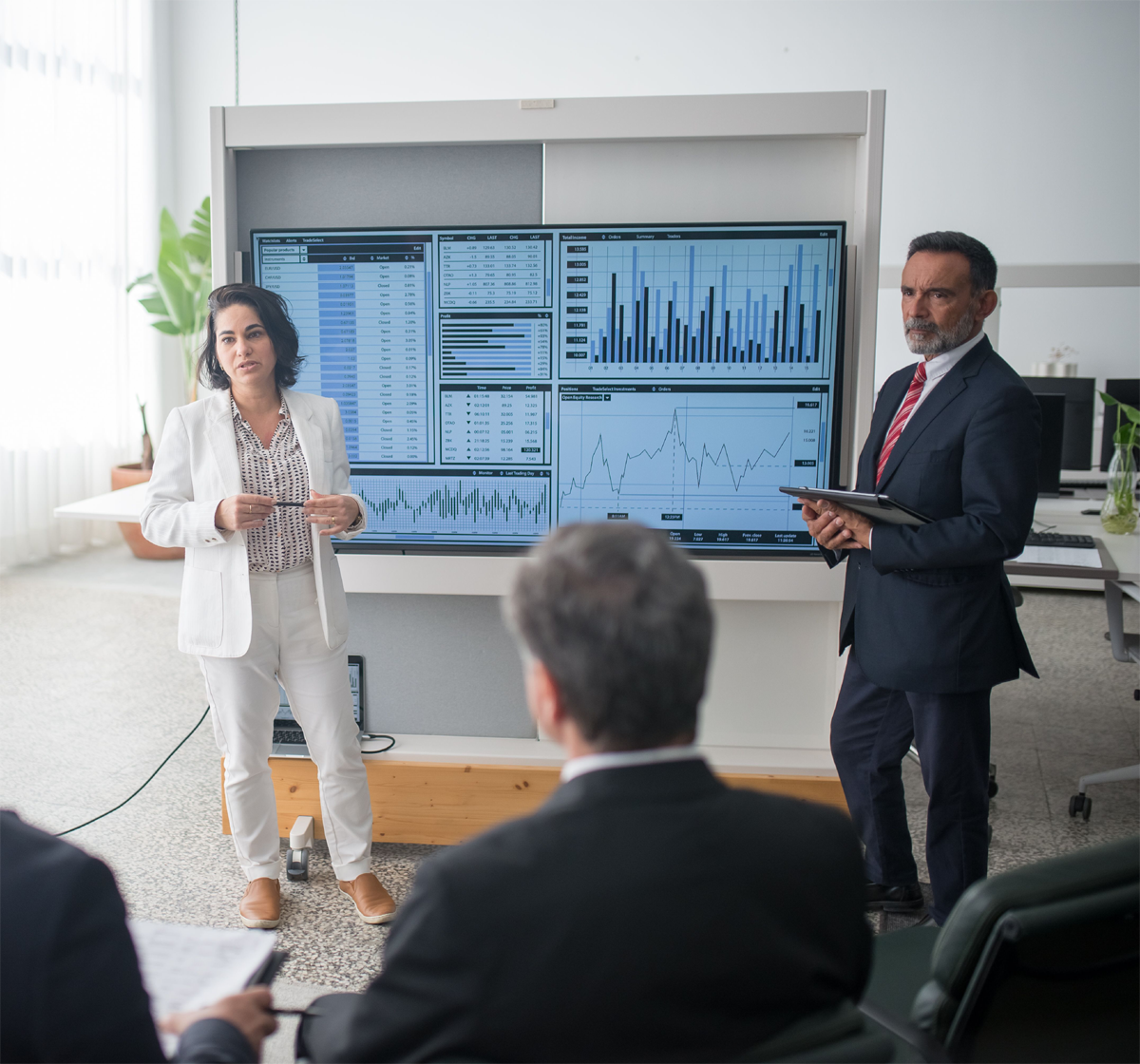 Business professionals reviewing financial documents together